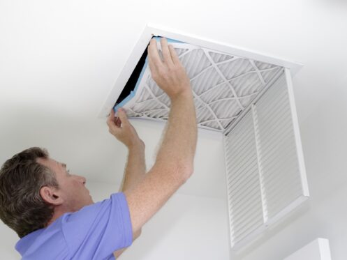 Man changing an air filter