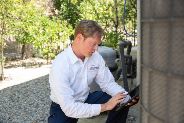technician performing maintenance on unit