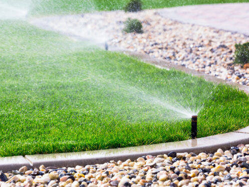 Sprinkler system watering a lawn