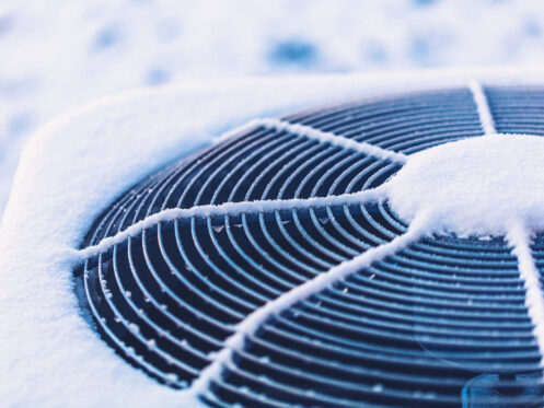 An AC unit that has ice on it.